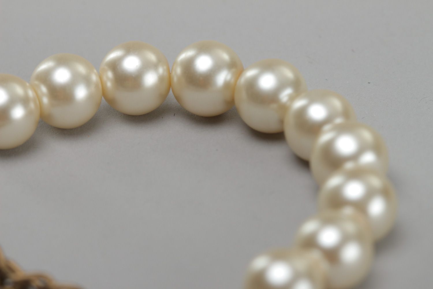 Elegant handmade bracelet with artificial pearls and metal charms for women photo 4