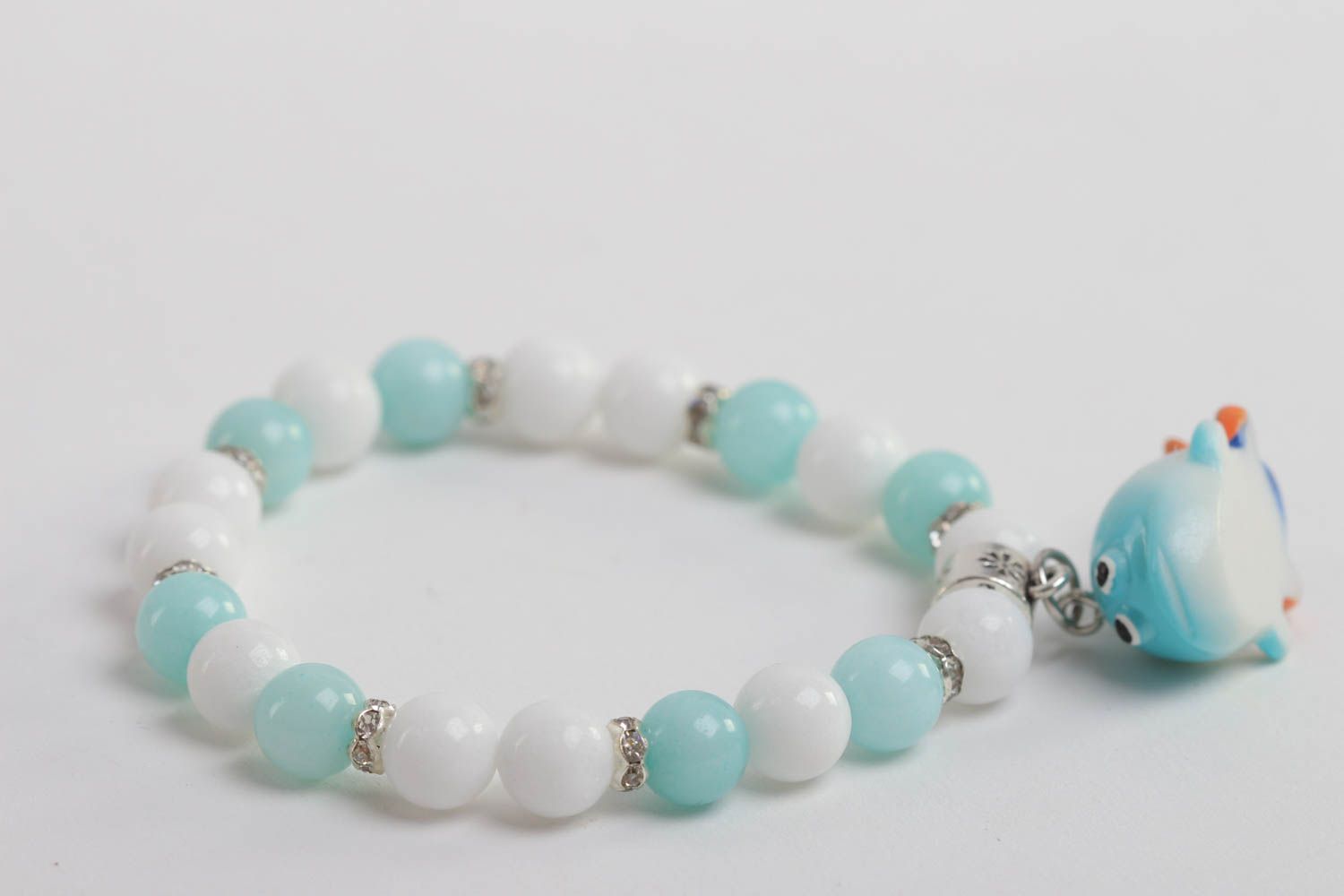 Turquoise and white beads elastic kids' bracelet with little wale charm  photo 3