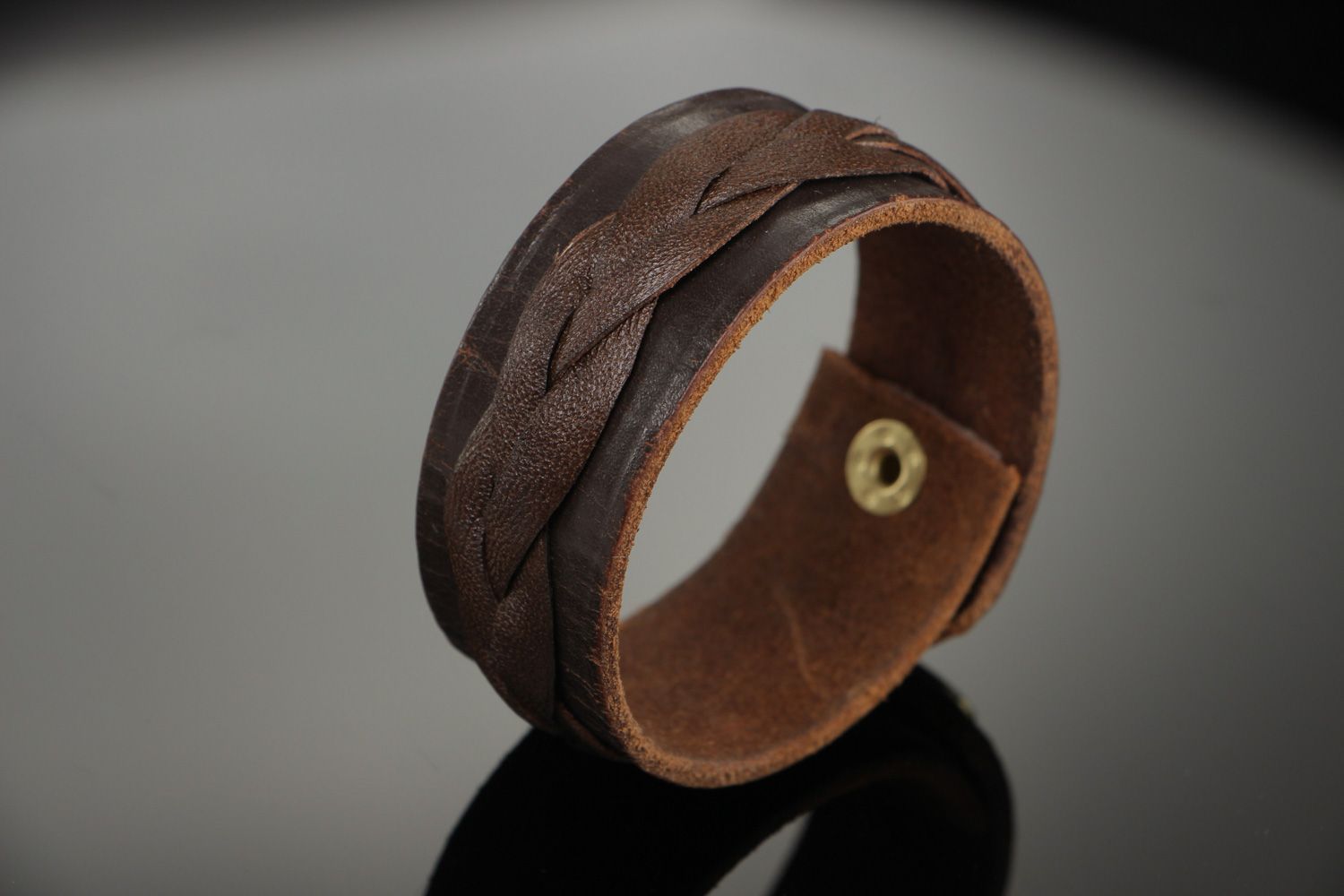 Handmade wrist bracelet woven of genuine brown leather with metal stud unisex photo 1