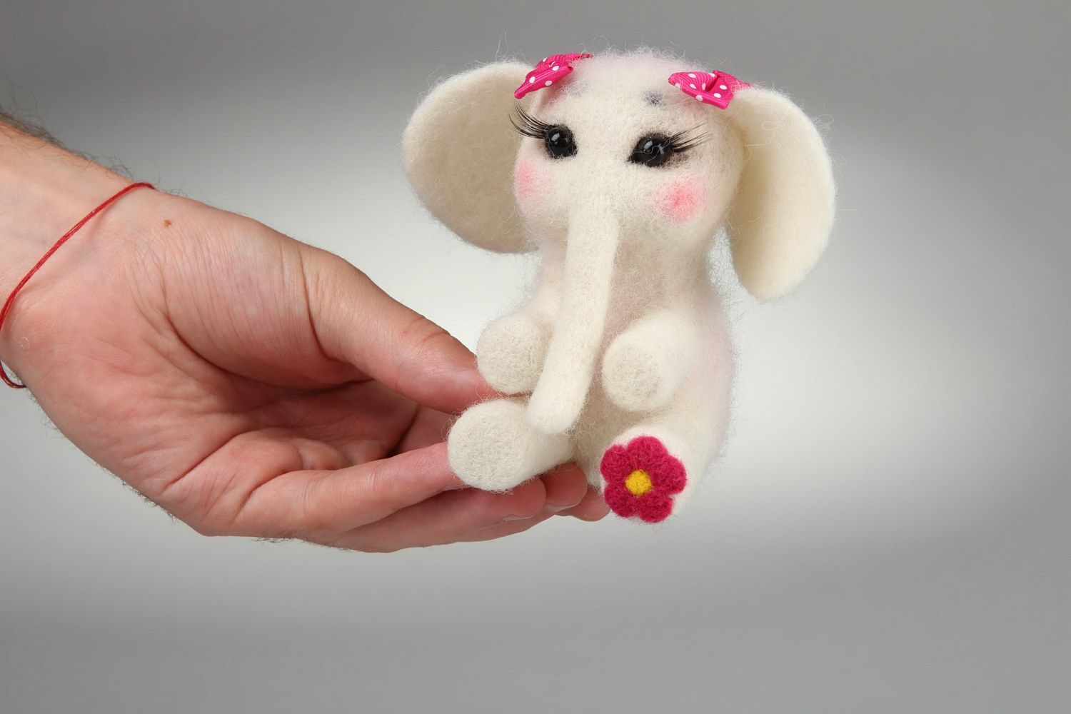 Felted soft toy Elephant with a bow photo 1