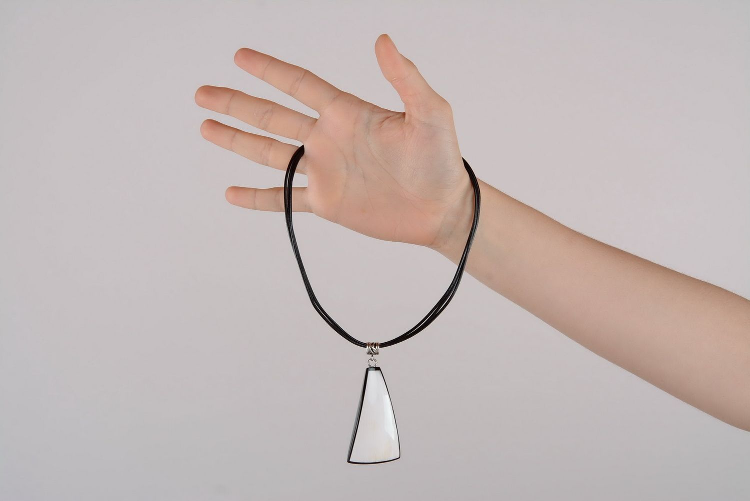 Pendant made of natural cow horn photo 2