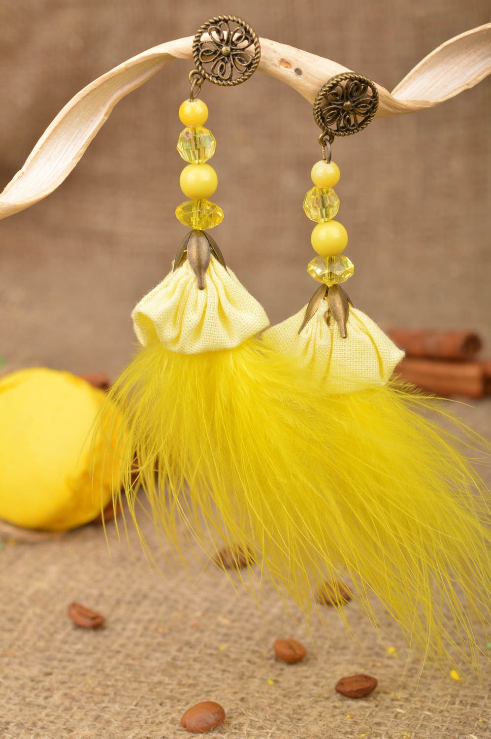Unusual cute handmade bright yellow long earrings with charms and feathers photo 1