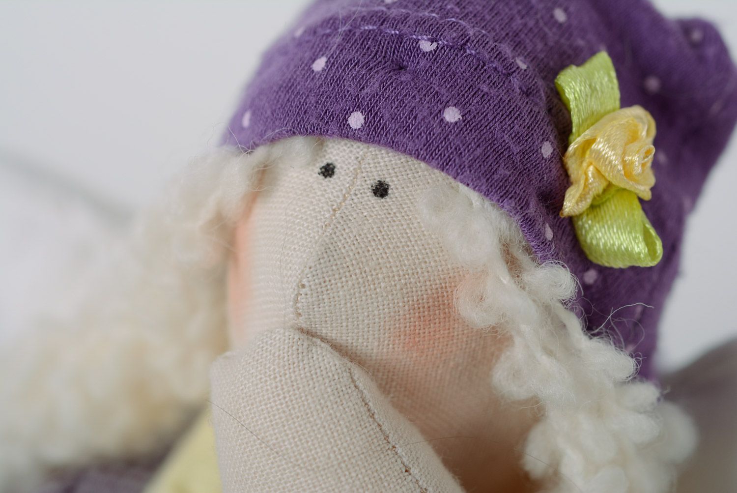 Handmade designer soft toy sewn of cotton in violet clothing for interior decor photo 2