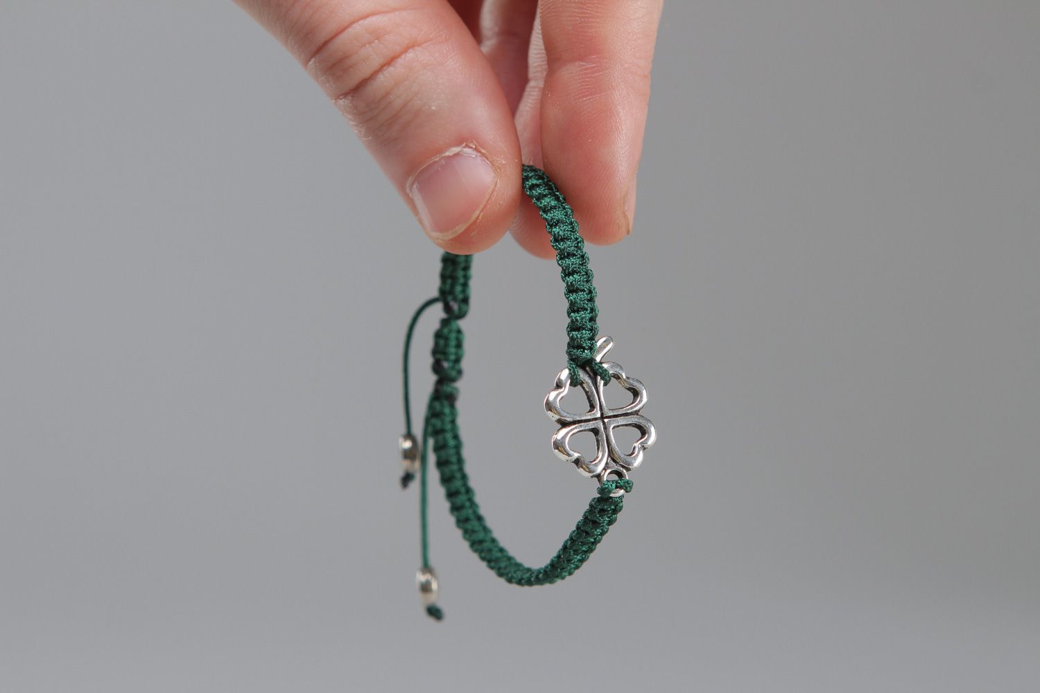 Handmade friendship bracelet woven of green threads with metal insert for women photo 3