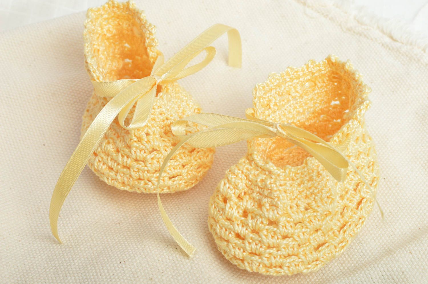Yellow cute crocheted baby booties with bows made of cotton for little girls photo 1