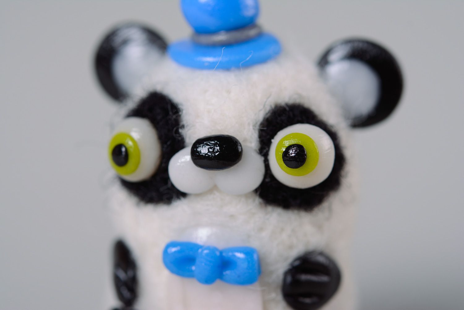Handmade miniature wool toy panda made using needle felting technique photo 4
