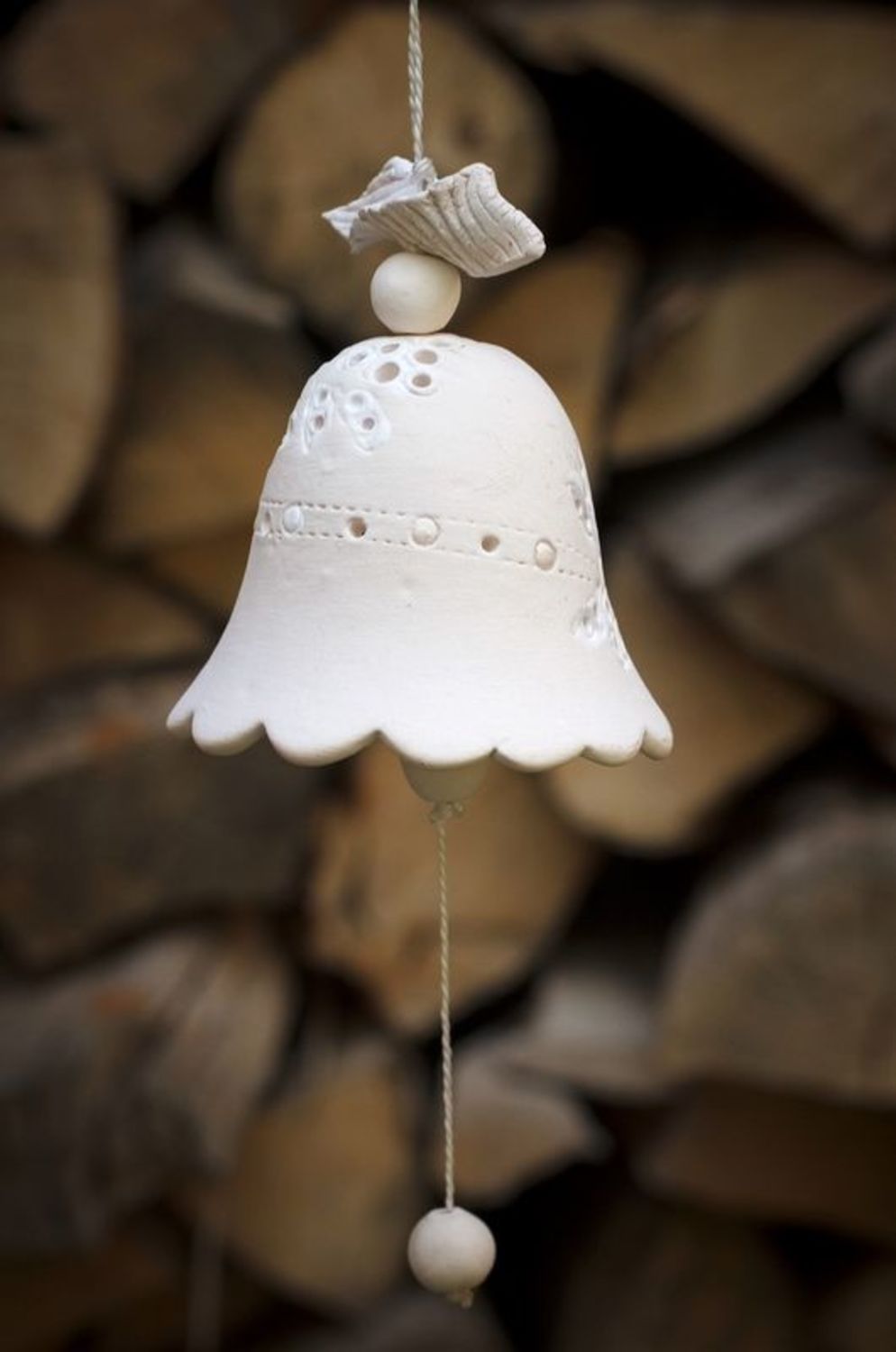 Ceramic bell made from white clay photo 1