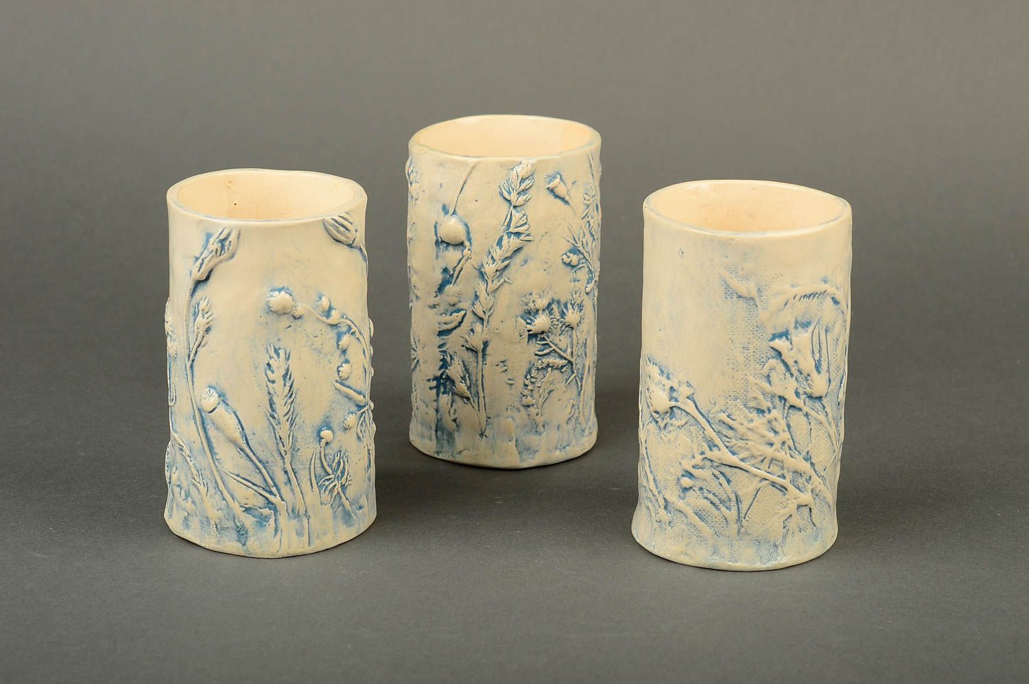 Three decorative ceramic tall white and blue coffee cups with field flowers pattern photo 1