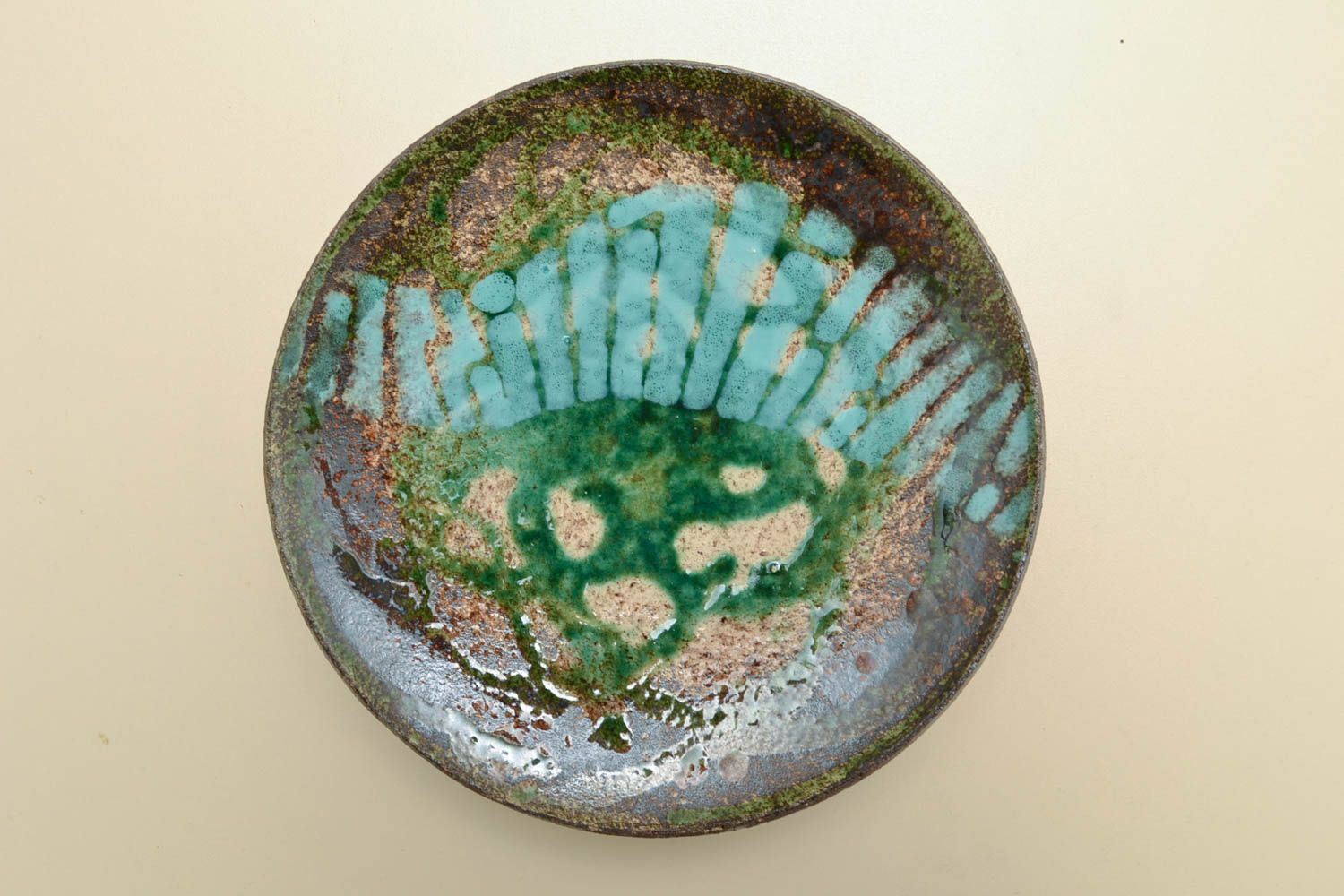 Clay plate painted with glaze  photo 1