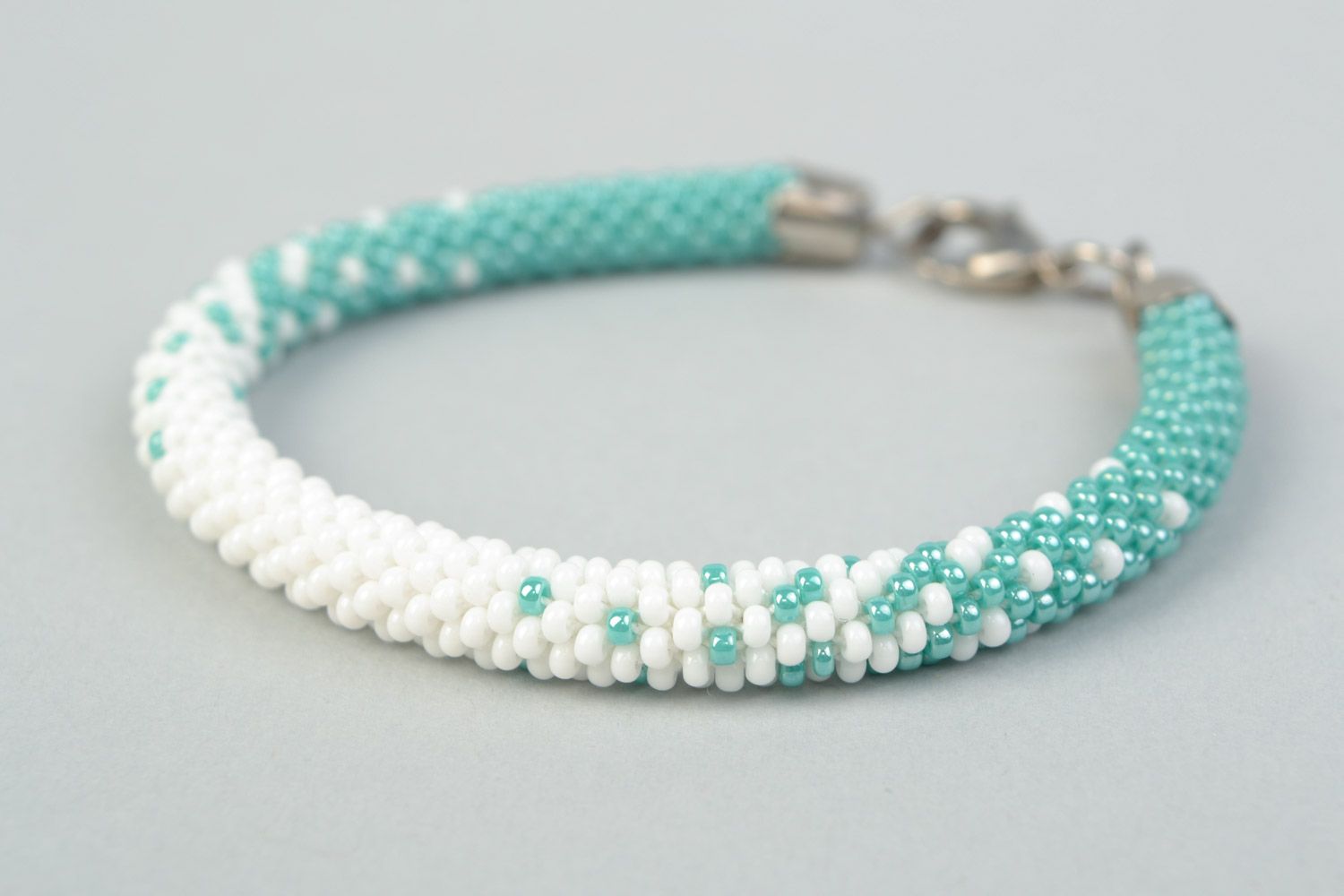 Tender handmade beaded cord wrist bracelet in white and turquoise color  photo 3
