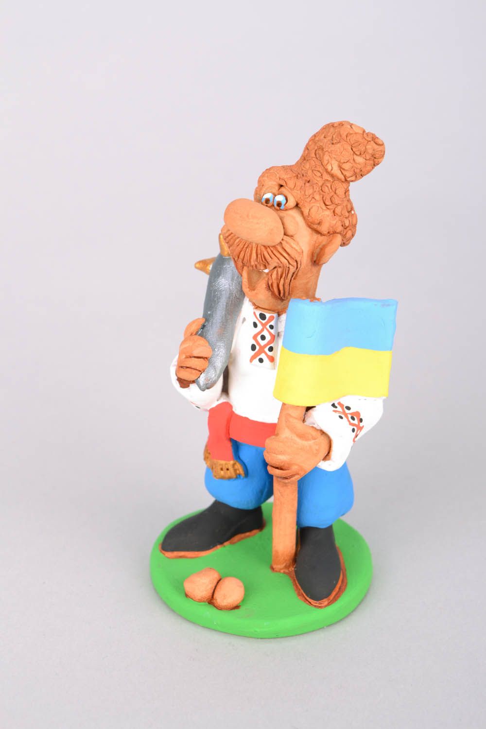 Homemade funny clay statuette Cossack with a Flag and a Saber photo 3
