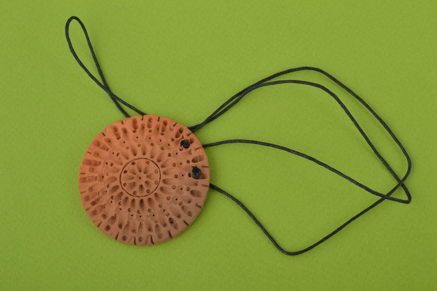 Handmade unusual pendant made of red clay on lace in ethnic style photo 1