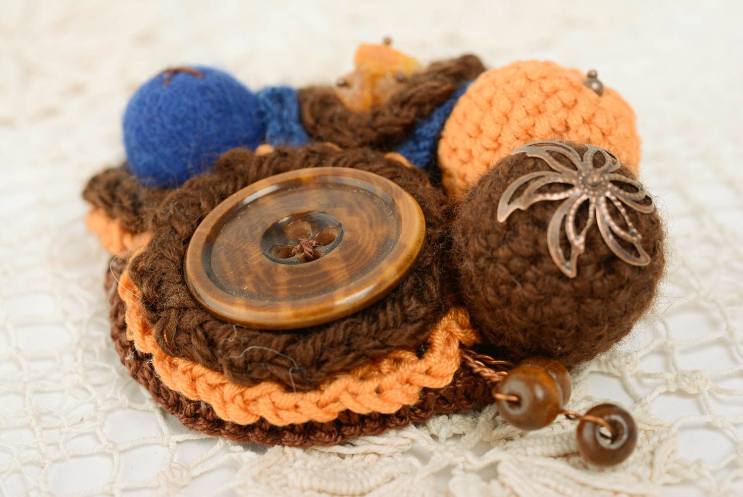 Handmade brooch crocheted of brown and blue woolen threads with wooden beads photo 1