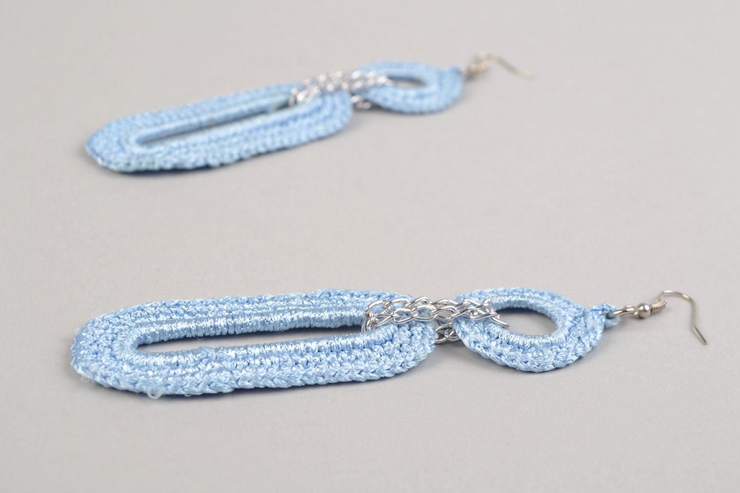 Handmade earrings with metal basis woven over with blue viscose threads photo 5
