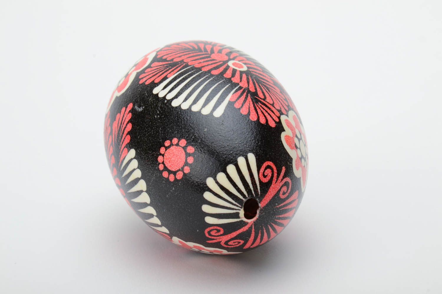 Handmade decorative painted Easter egg with ornament on black background photo 4