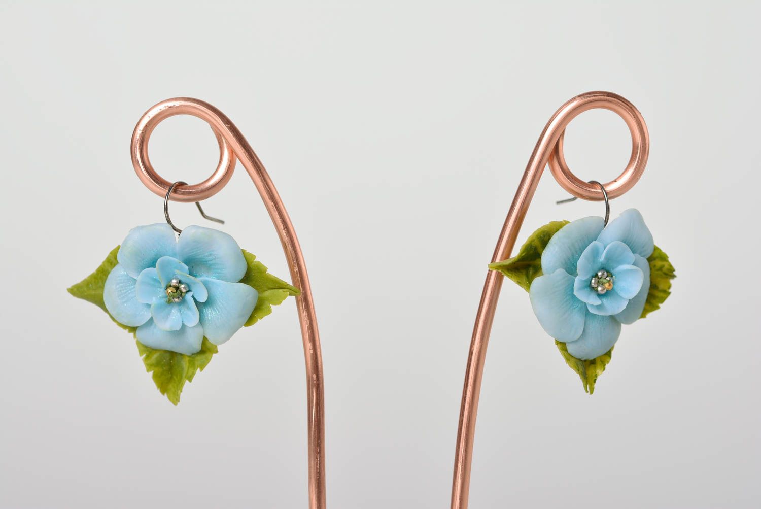 Handmade designer dangling earrings with tender blue polymer clay flowers  photo 1