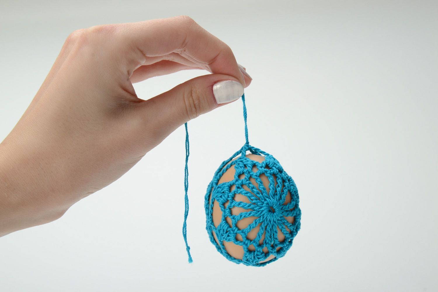 Homemade blue Easter egg crocheted over with cotton threads photo 5