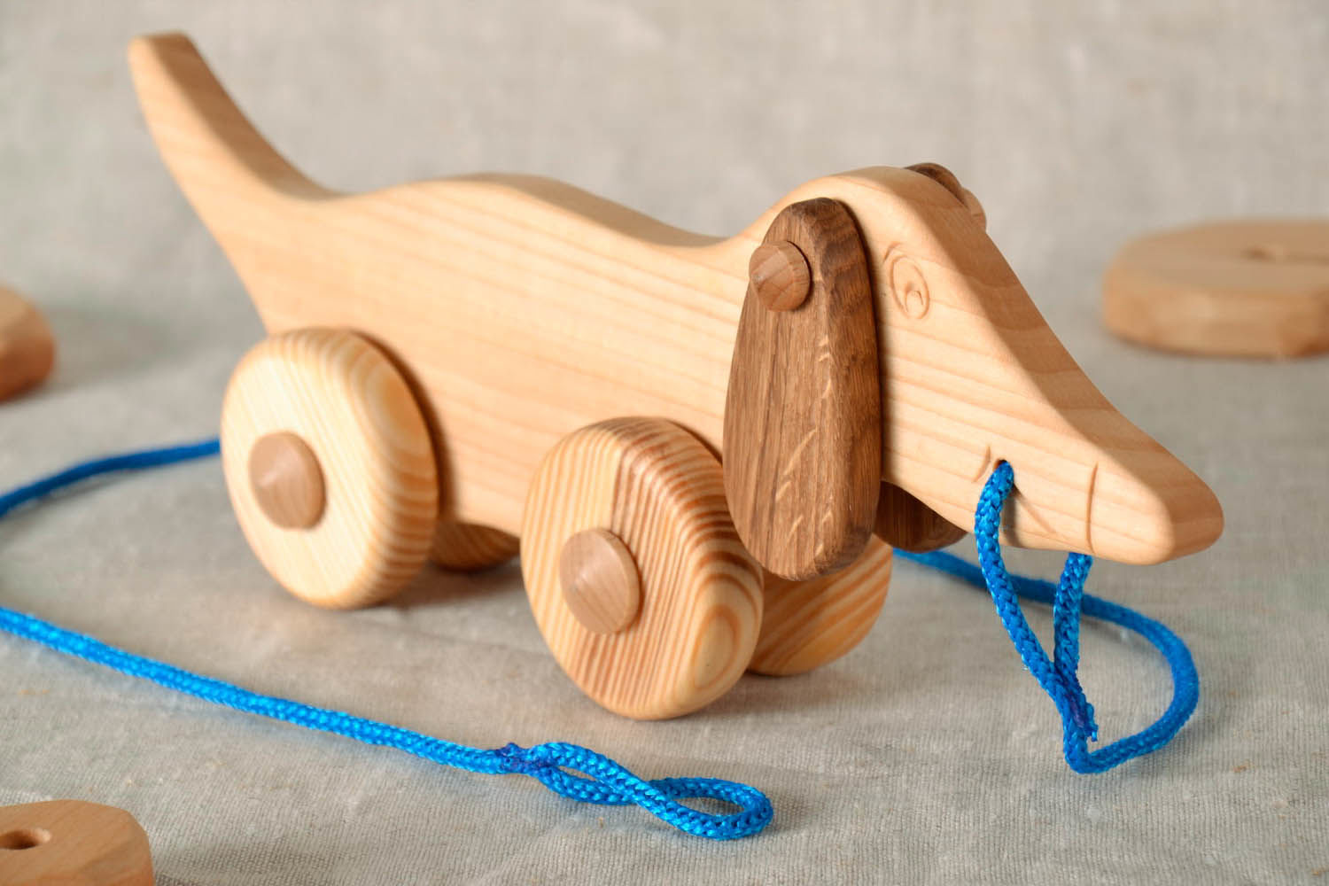Toy on wheels Dachshund made of wood photo 1