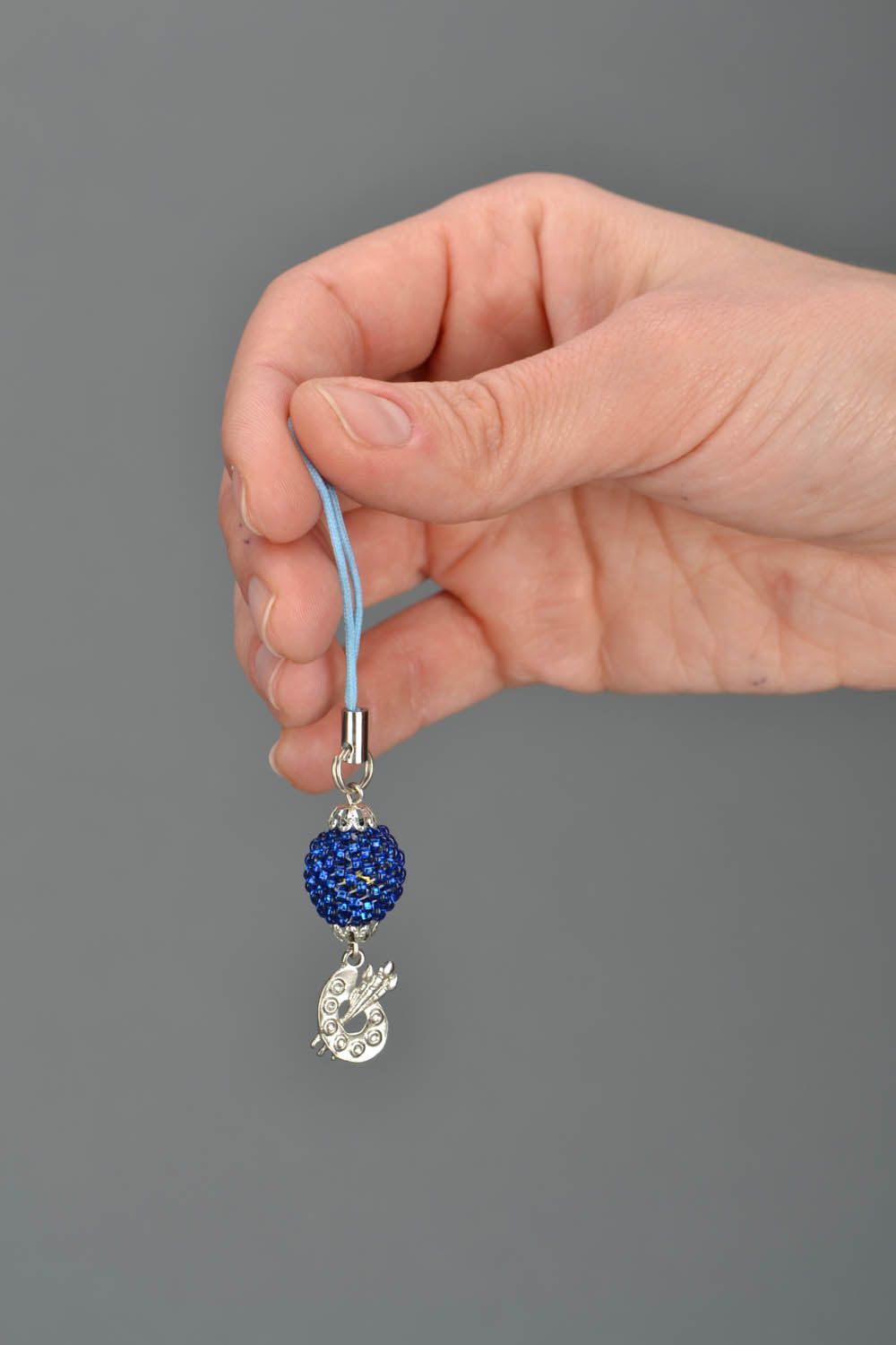 Cell phone charm of blue color photo 2