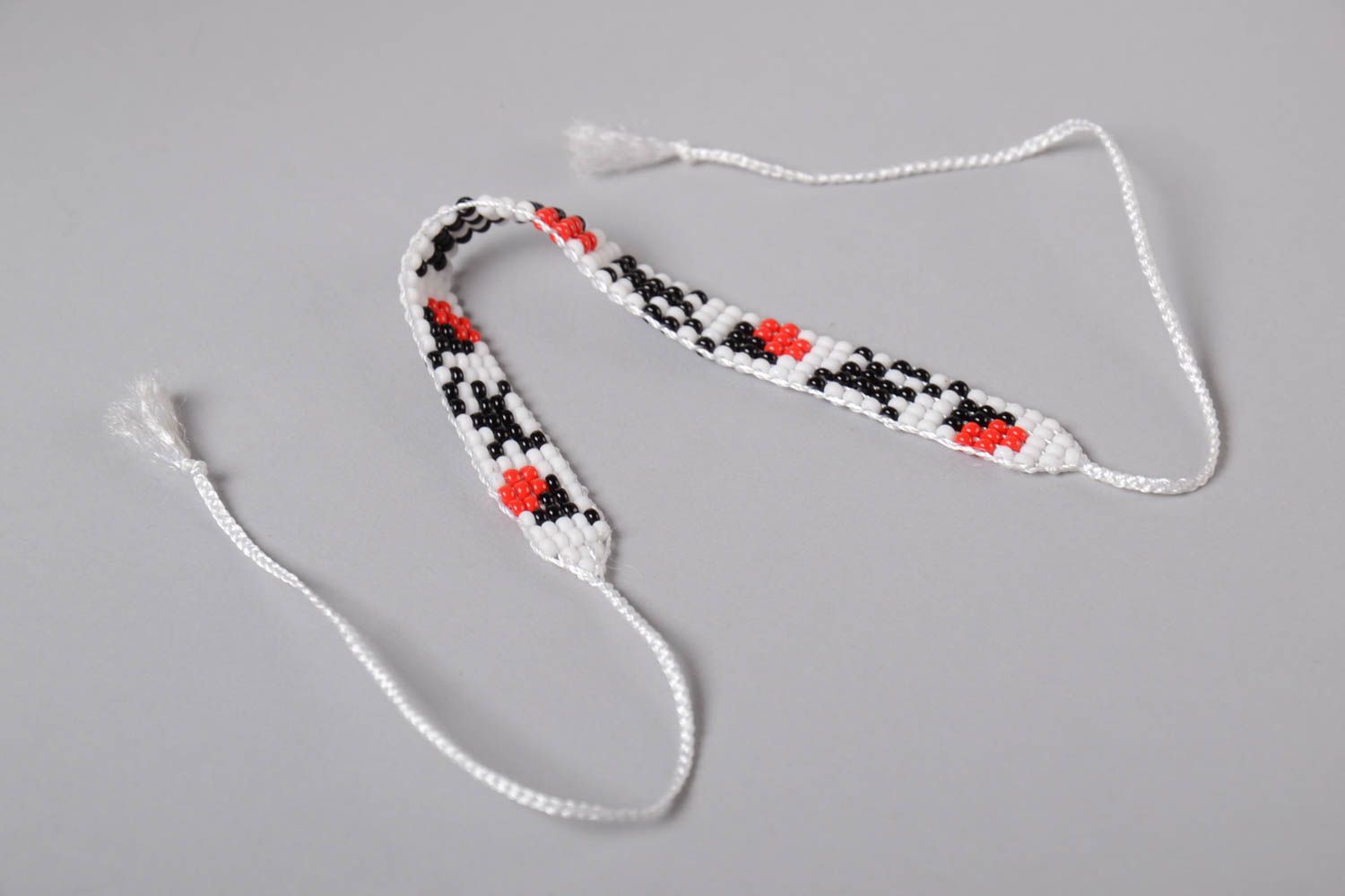 White, black, red, and green color beads strand bracelet on the white cord for teen girls photo 5