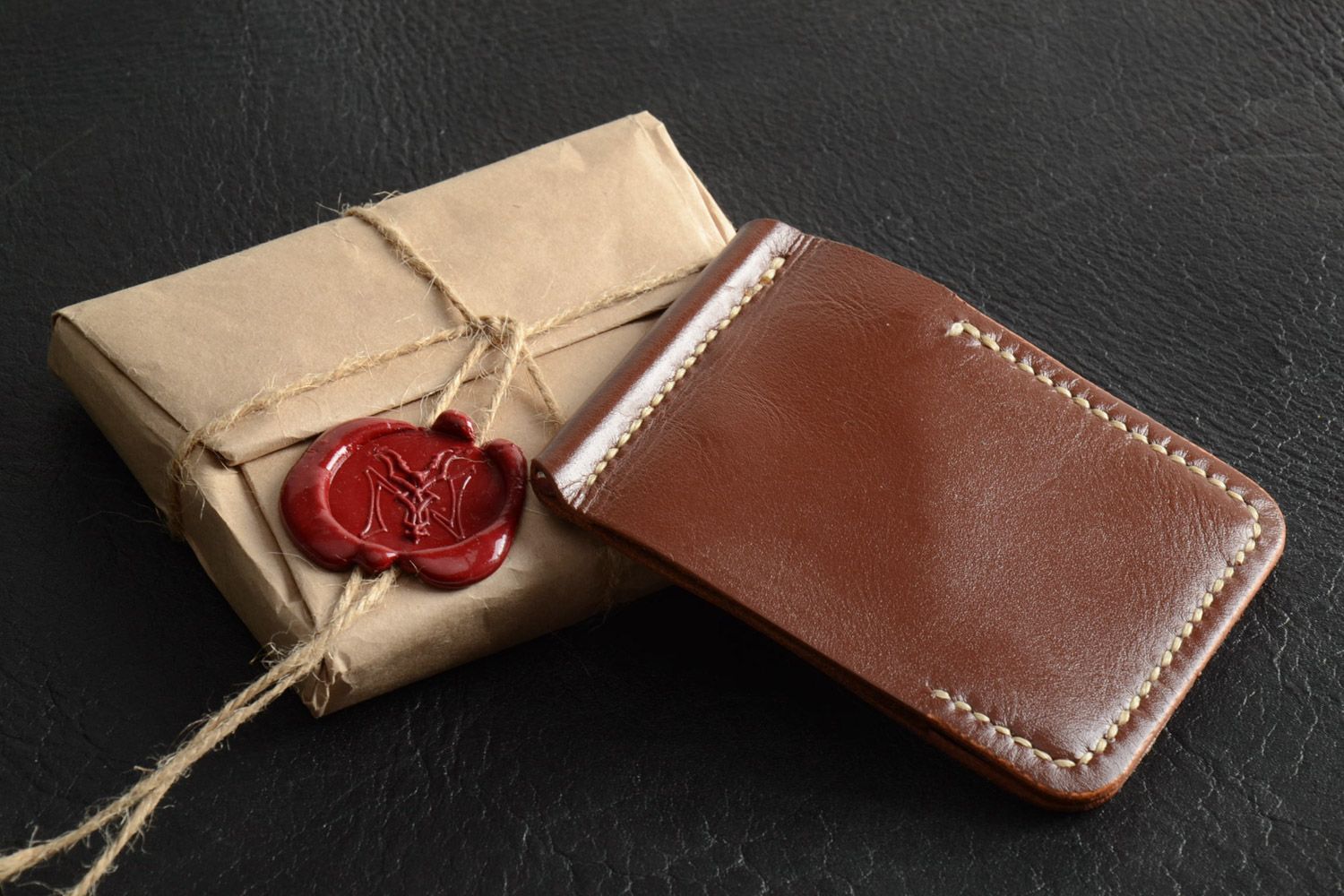 Homemade genuine leather wallet of brown color sewn with waxed thread with clip  photo 1
