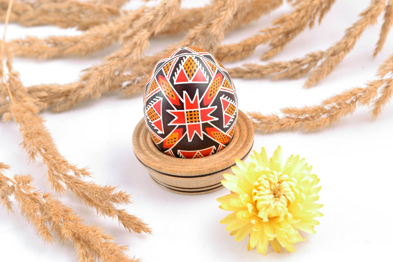 Handmade painted chicken egg with solar symbol photo 1