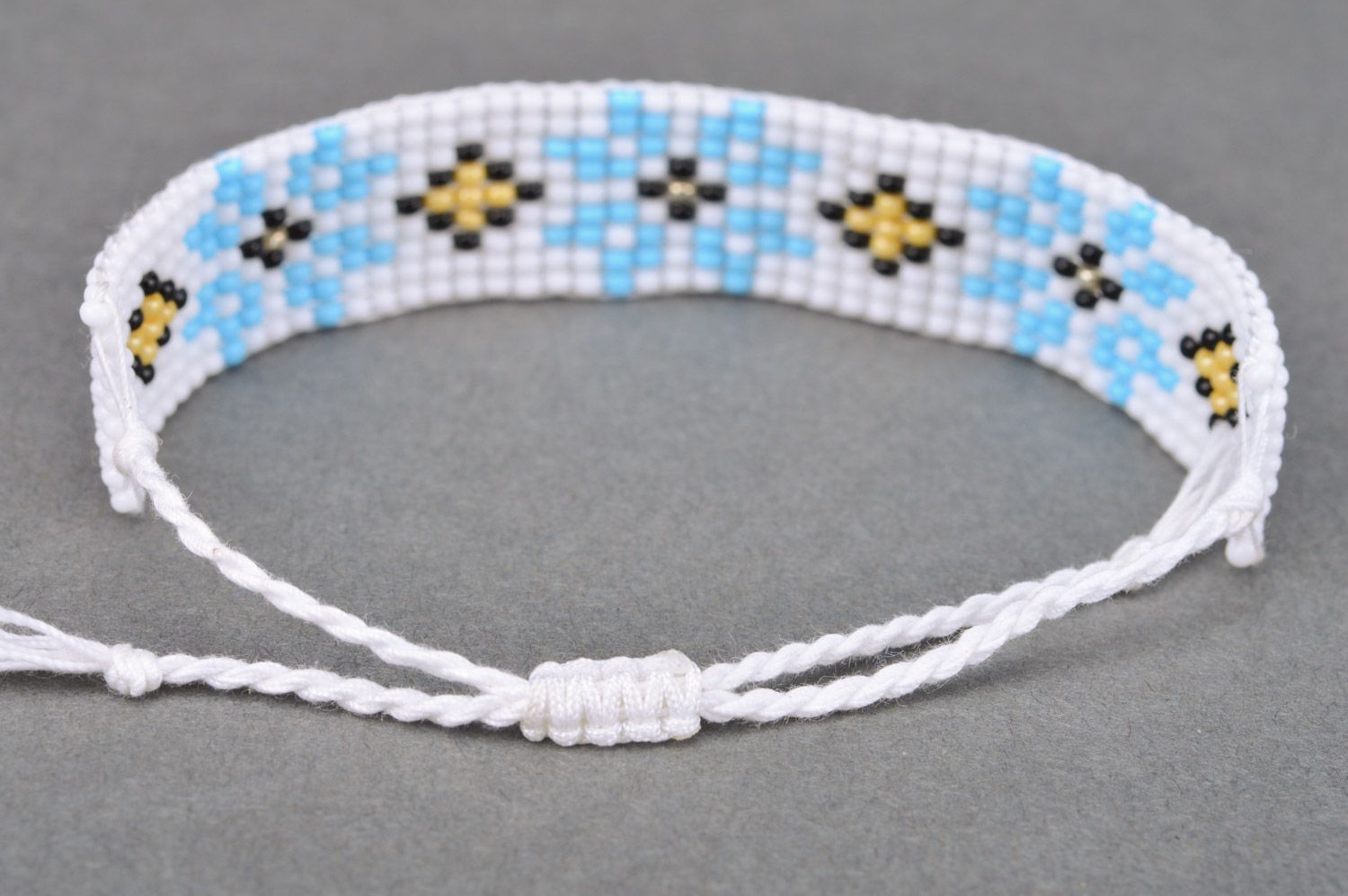 Broad handmade wrist bracelet with ethnic ornament in white and blue colors photo 5