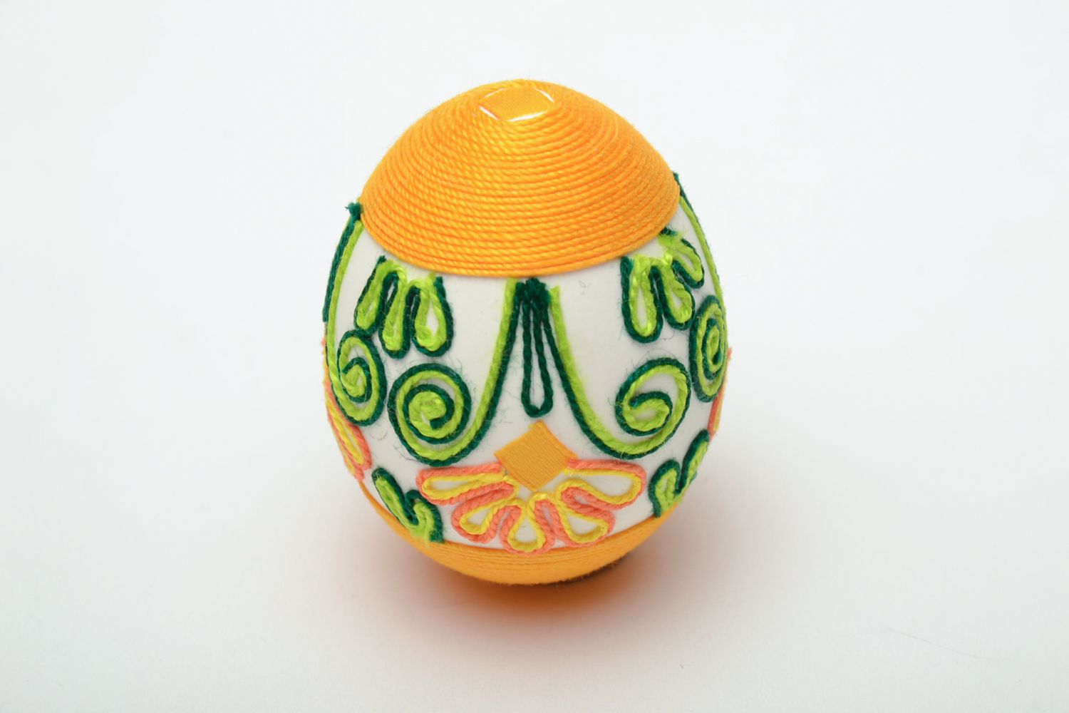 Handmade Easter egg decorated with yellow threads photo 2