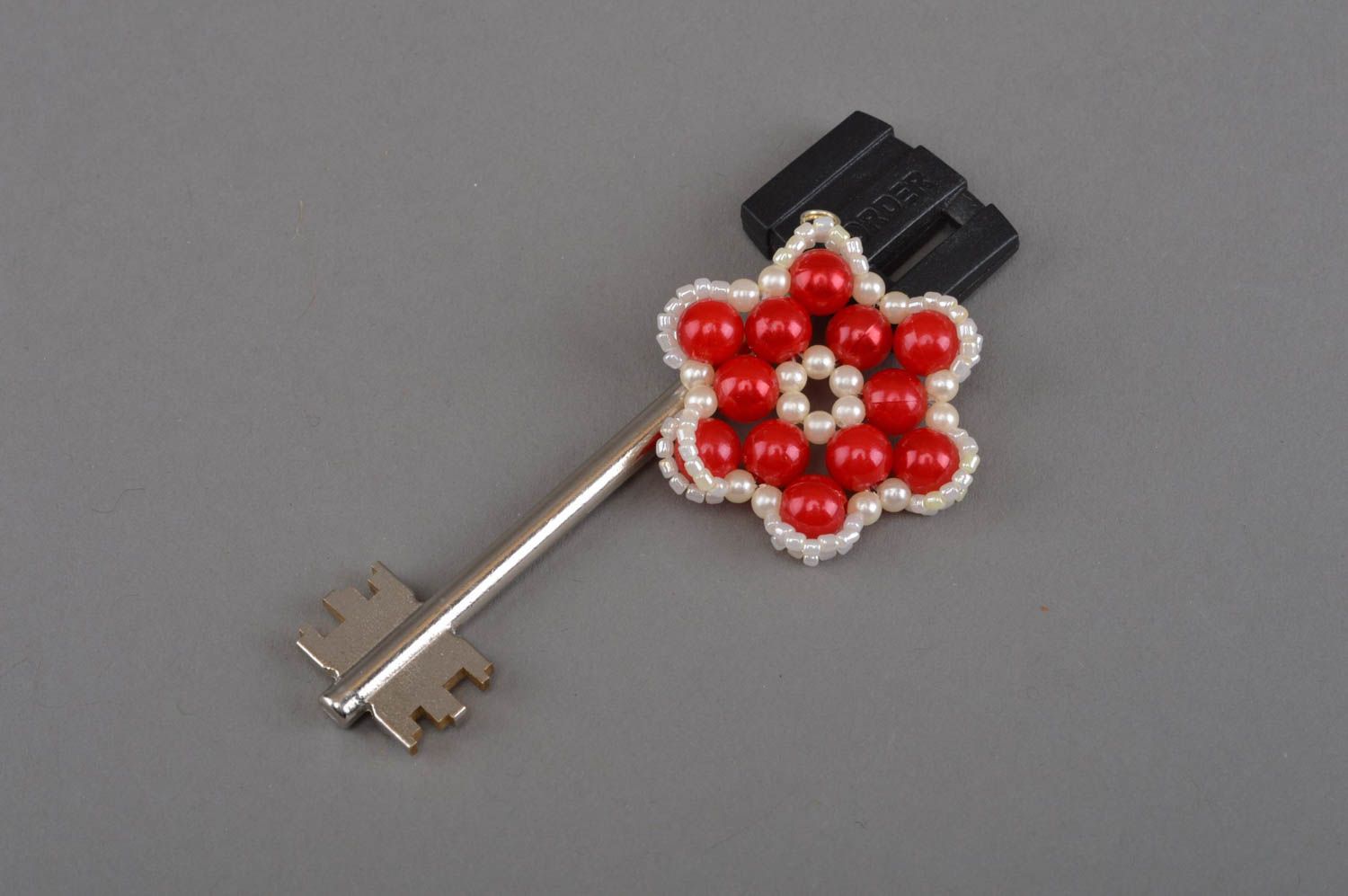 Handmade stylish red keychain braided in the form of a beautiful flower photo 1