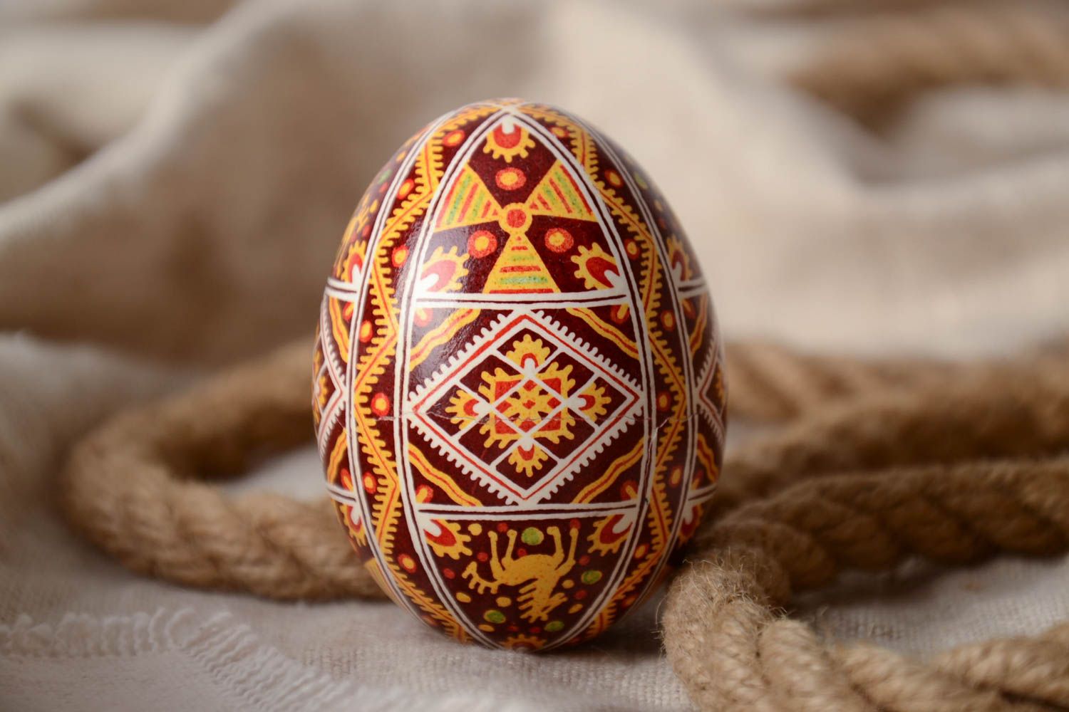 Handmade decorative painted egg pysanka with ornaments ethnic souvenir for Easter photo 1