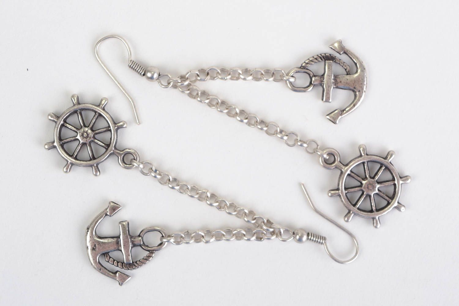 Handmade designer long dangling earrings cast of metal alloy anchor and wheel  photo 1