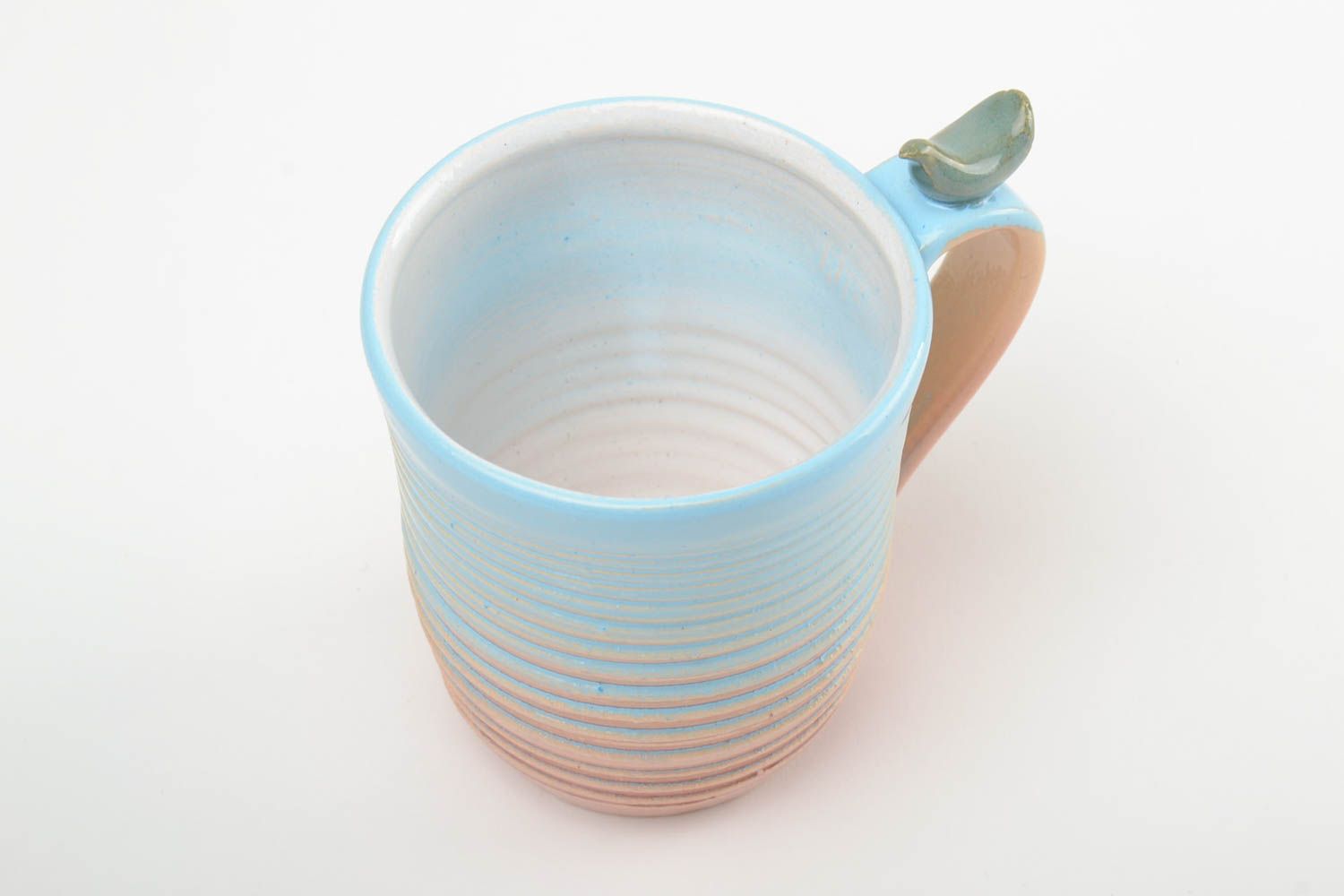 10 oz porcelain handmade drinking cup in blue, white, and beige colors with handle photo 4