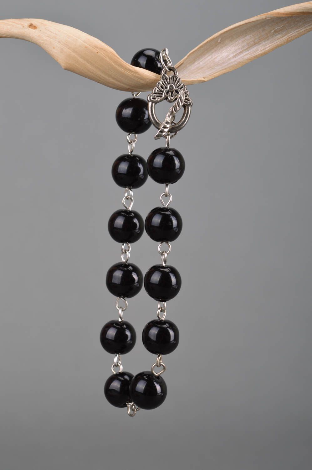 Designer women's wrist handmade bracelet with metal elements and black beads photo 3