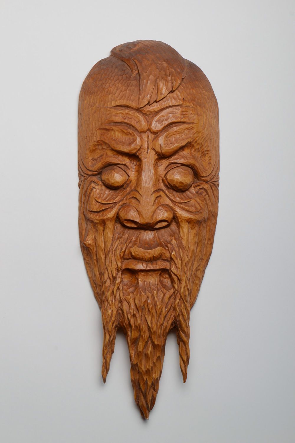 Handmade decorative hanging wall mask carved of wood and coated with varnish photo 1