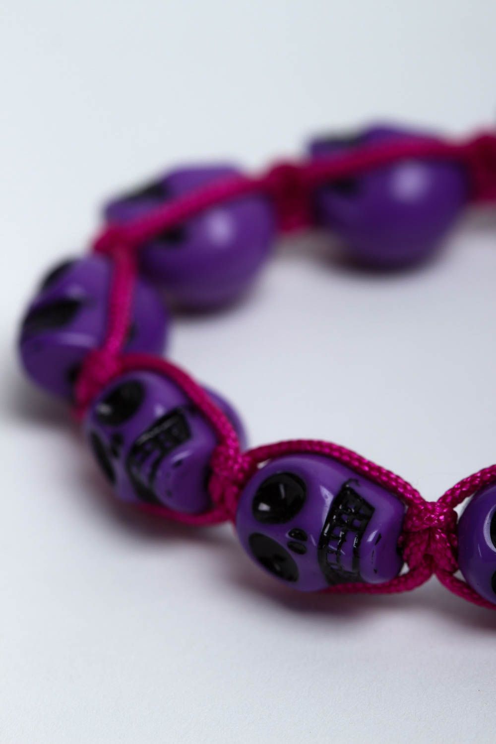 Purple strand skull beads bracelet on red cord for young girls photo 3