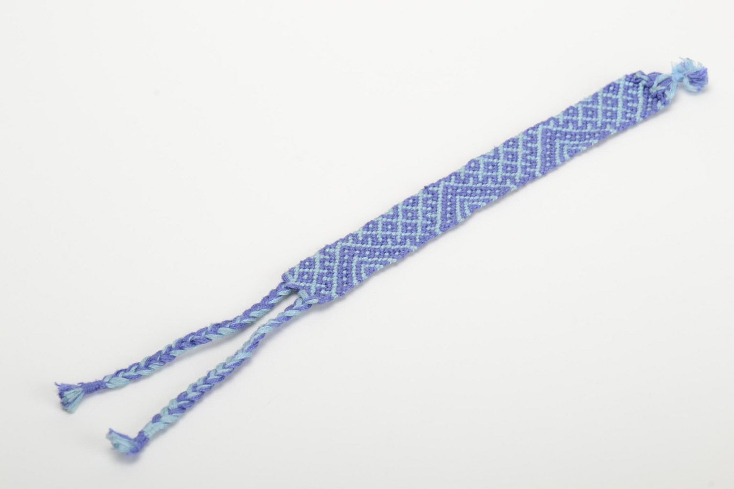 Handmade friendship wrist bracelet woven of threads in blue color with ties photo 2