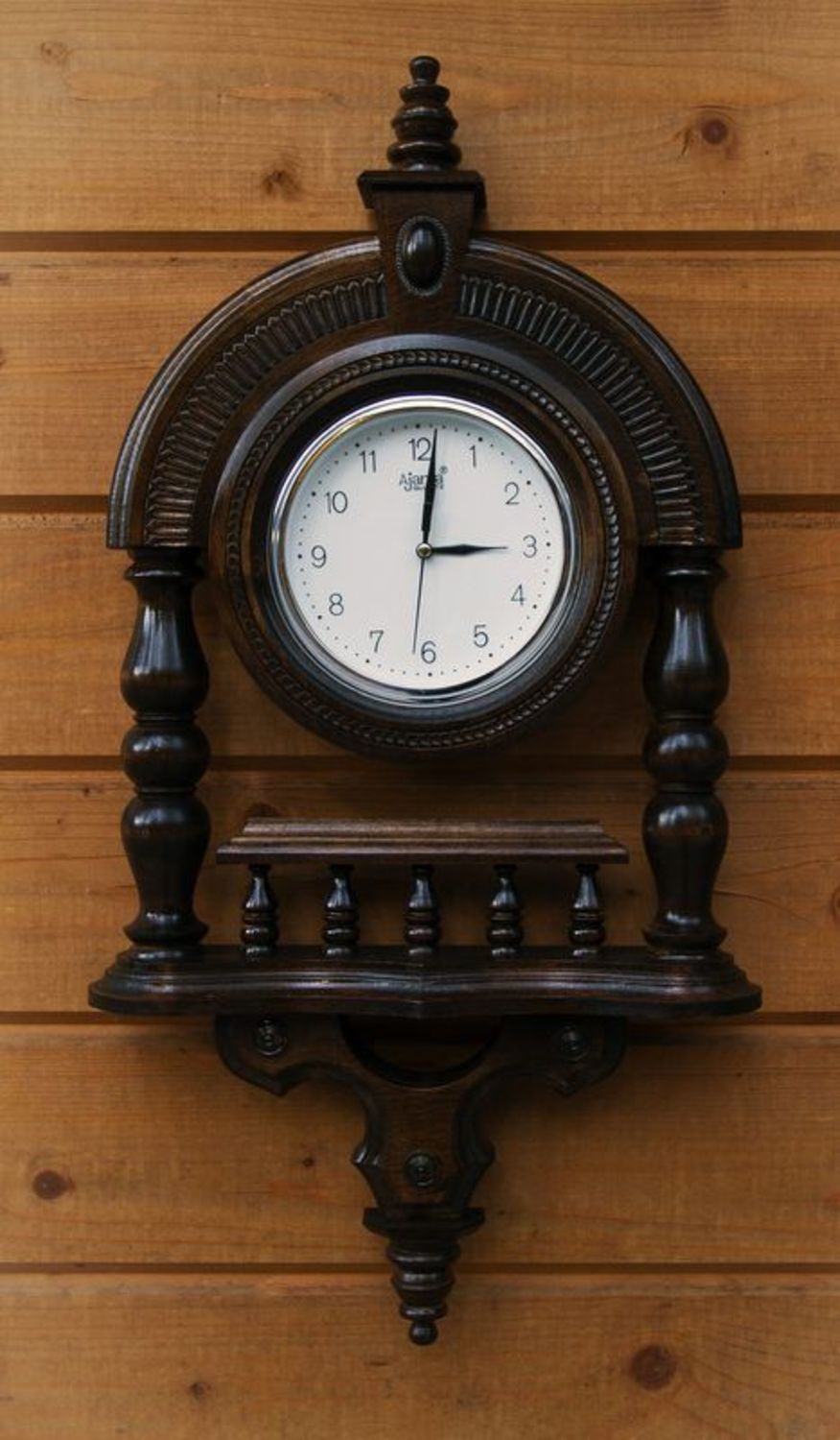 Wooden wall clock with pillars photo 6