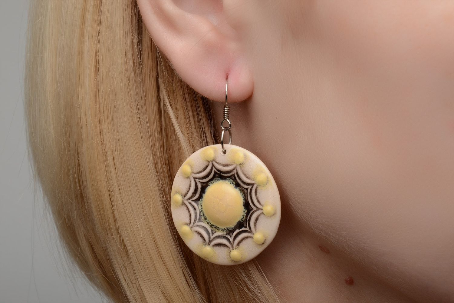 Handmade beige ceramic dangle earrings of round shape painted with enamels photo 2