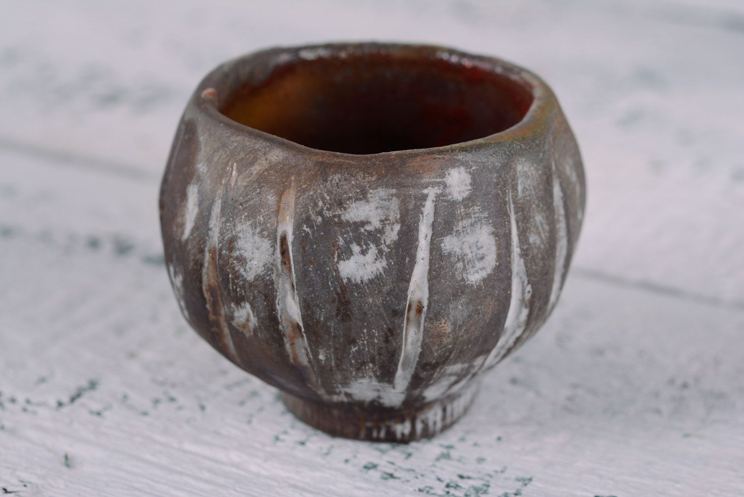 Kilned clay cup without handles in dark brown colo with white insights photo 1