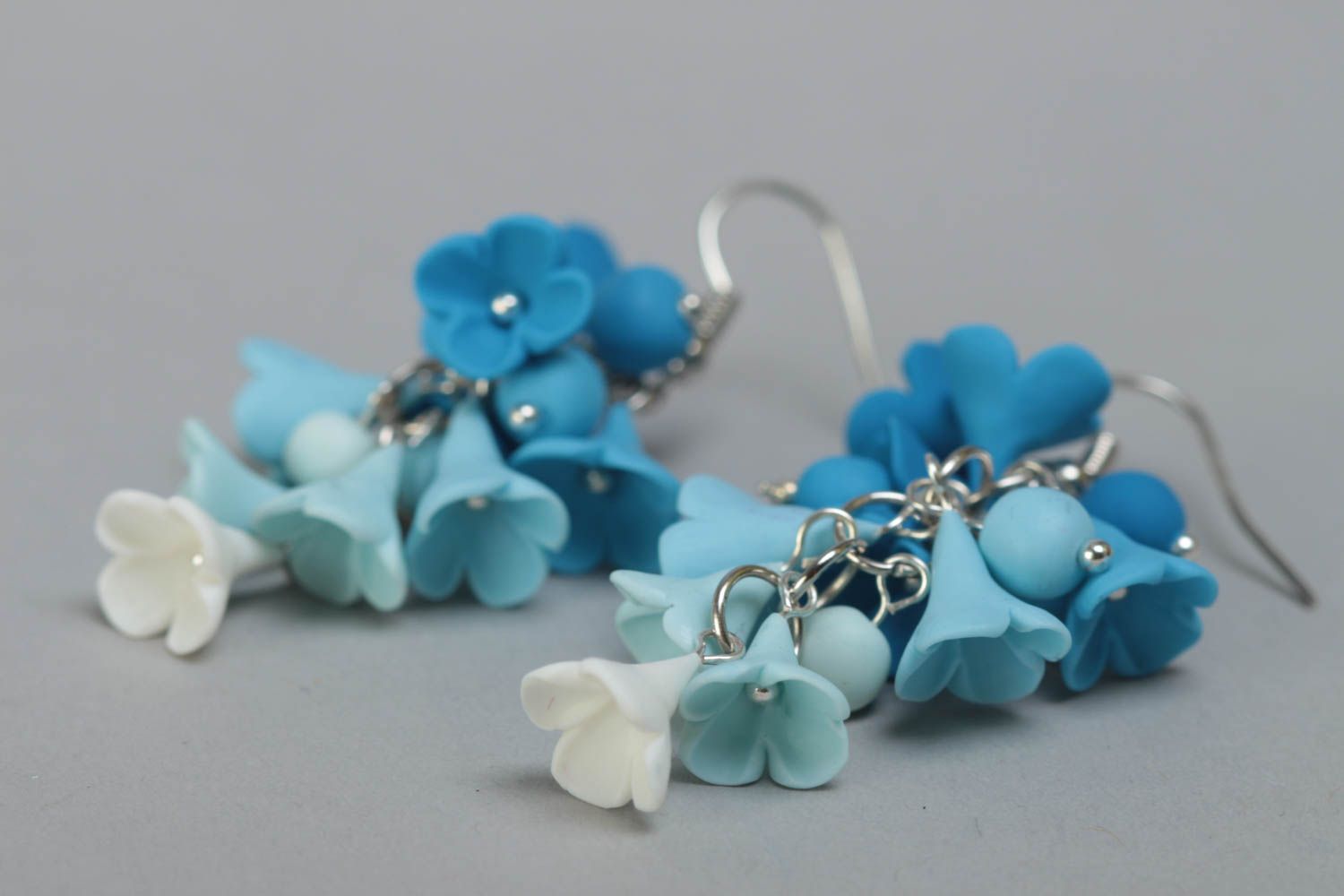 Handmade designer polymer clay flower dangle earrings in blue color palette photo 3
