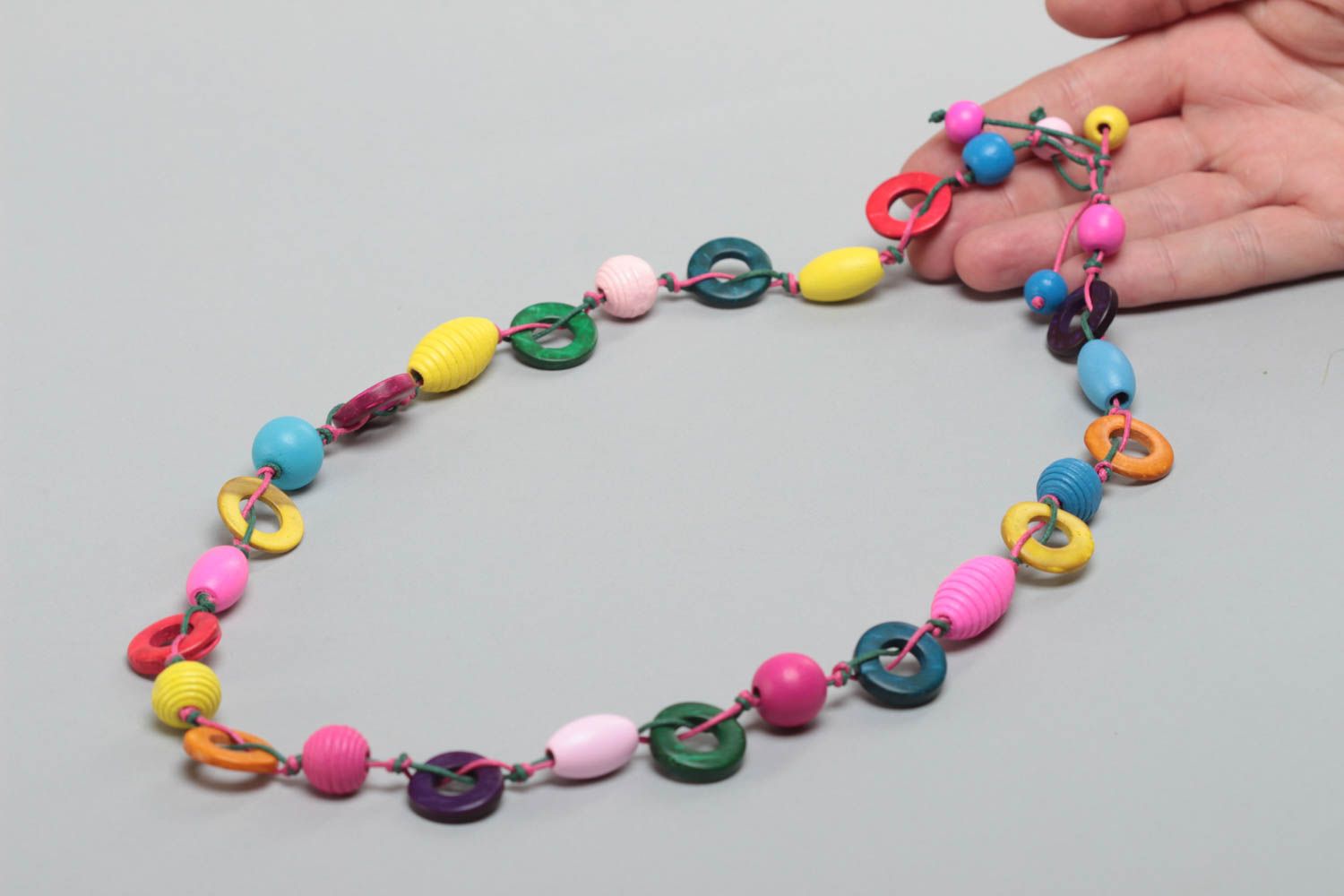 Beautiful bright necklace with wooden and coconut beads for children photo 5