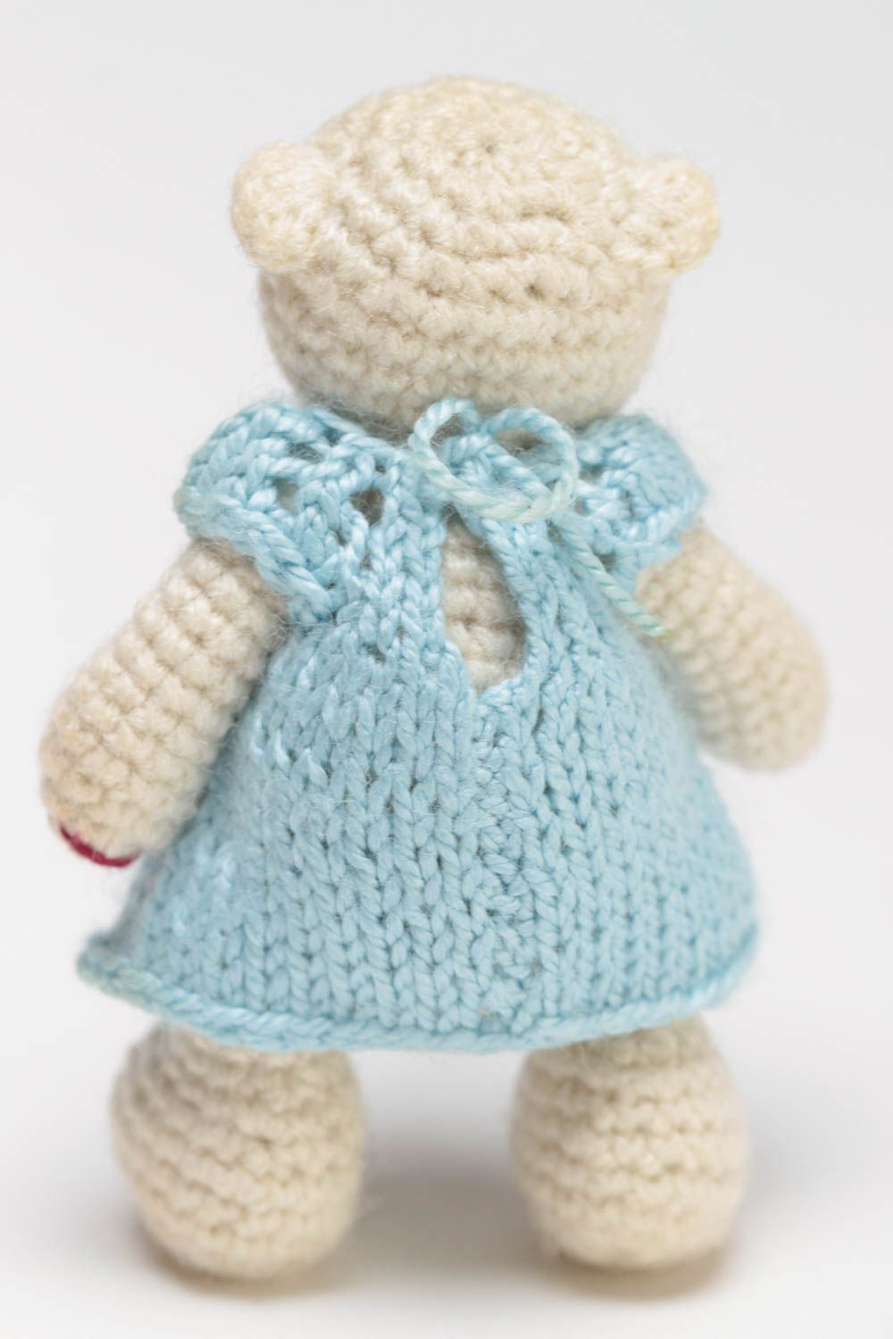 Handmade small crocheted soft toy beige bear girl in blue dress with bow photo 4