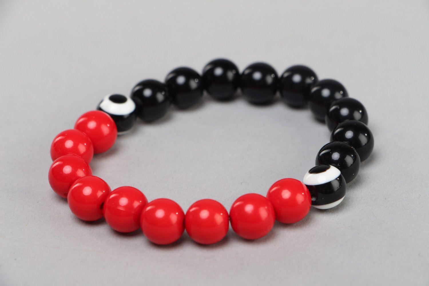 Handmade stretch wrist bracelet with red and black plastic beads for women photo 1