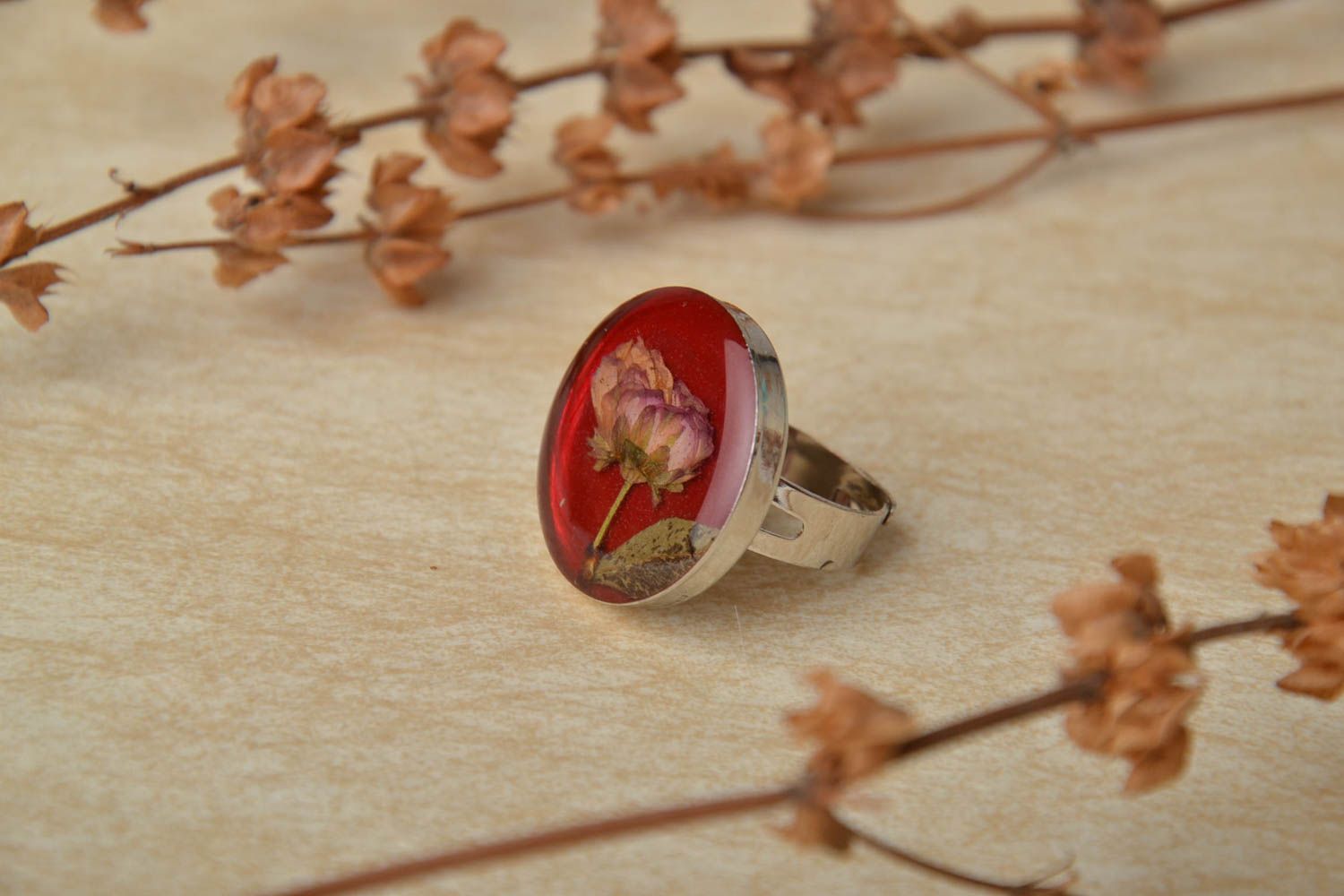 Unusual round ring with natural flower in epoxy resin photo 1