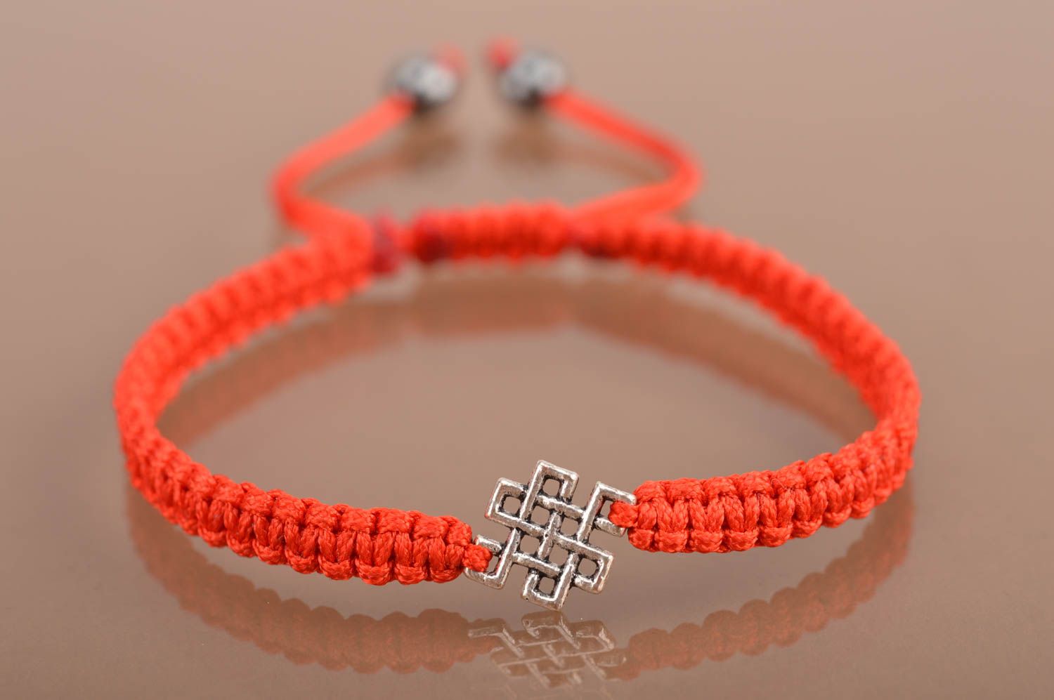 Handmade designer woven red silk friendship bracelet with metal insert photo 2