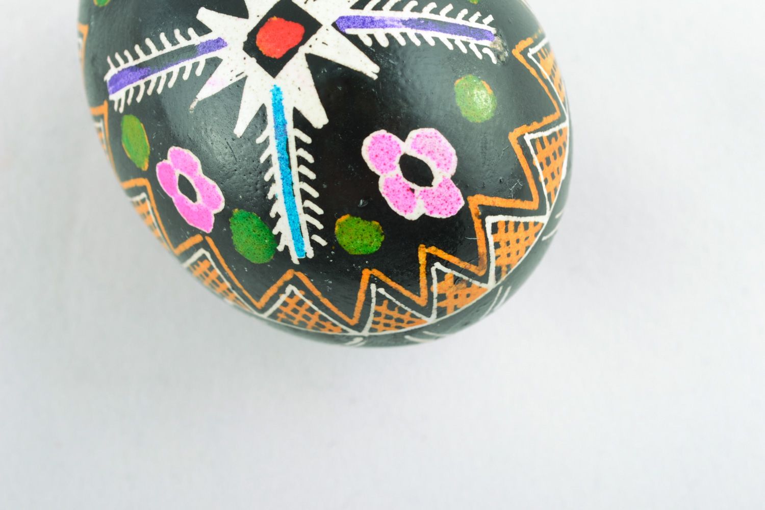 Homemade Easter egg with traditional ornament on black background made with hot wax photo 5