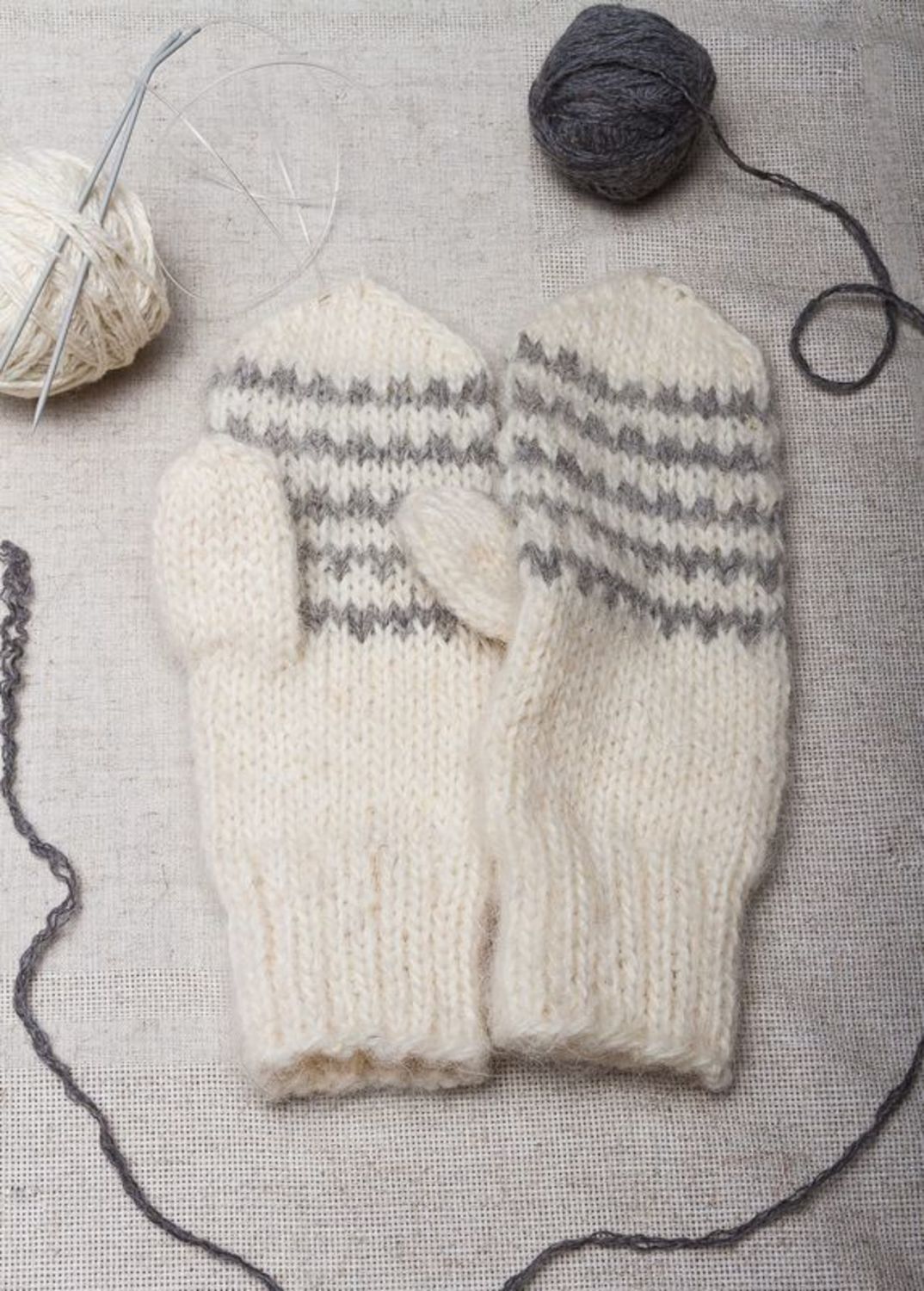 White knitted mittens with grey ornament  photo 1