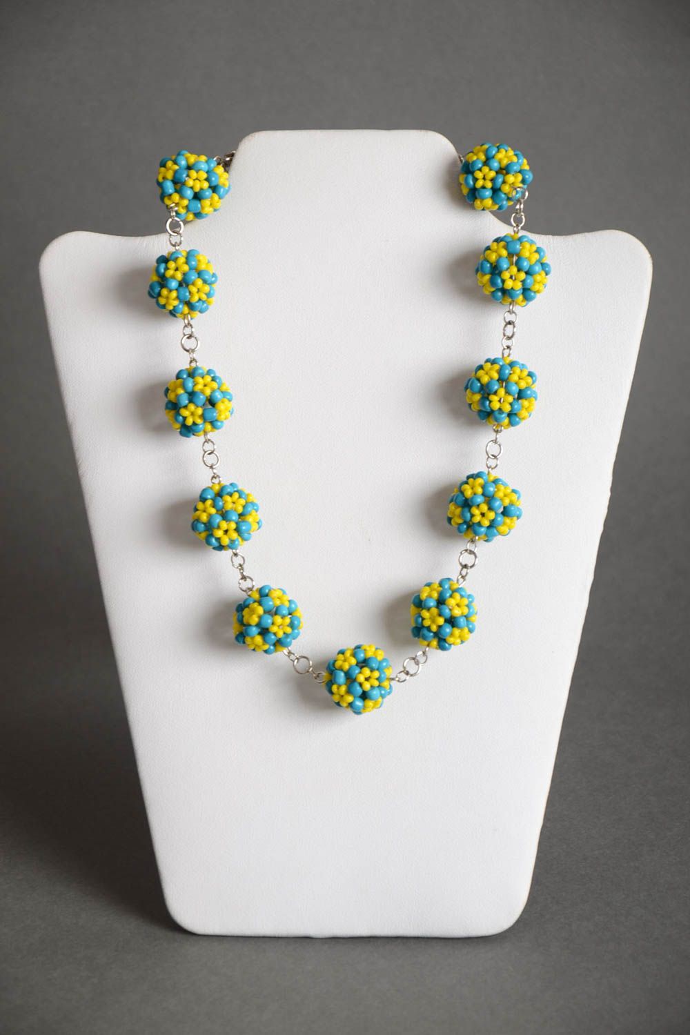 Handmade designer necklace with metal chain and bead woven blue and yellow balls photo 2