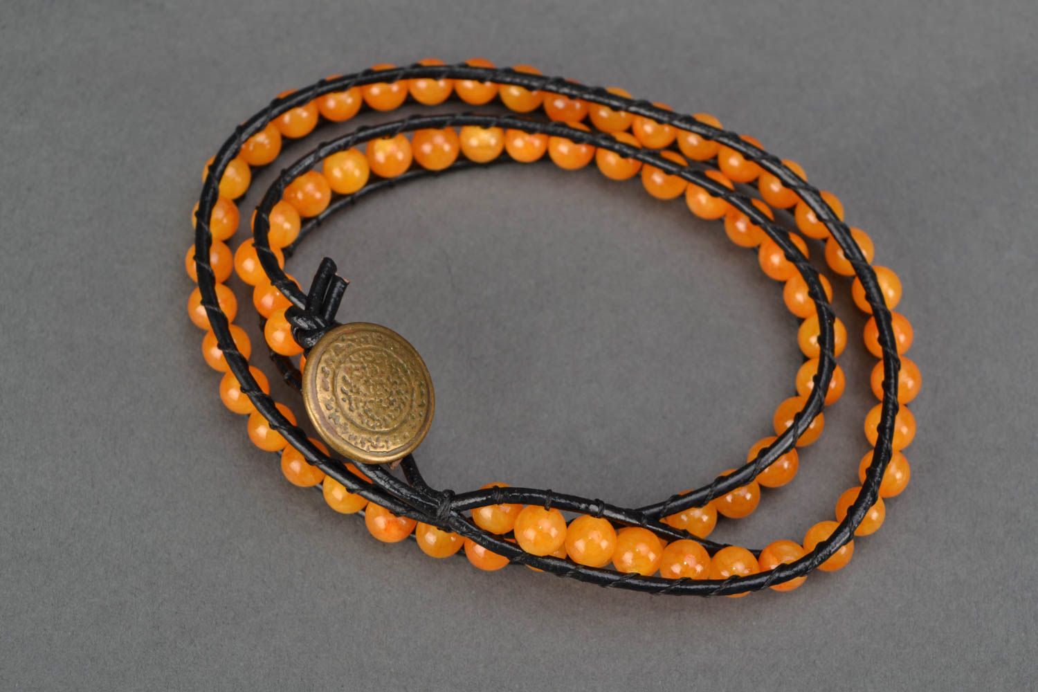 Orange leather beaded bracelet in three rows photo 4