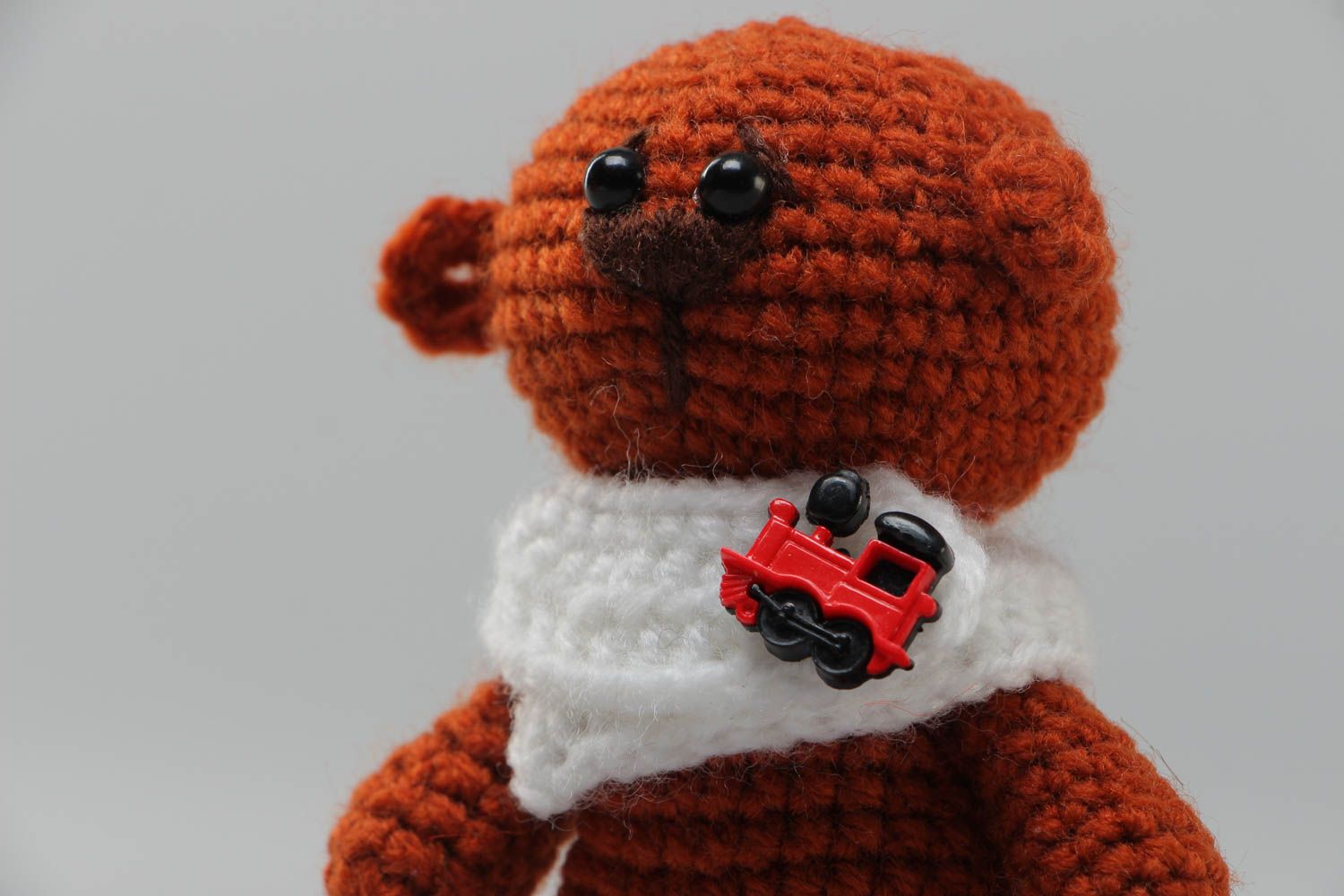 Soft handmade crocheted toy bear in brown with a small collar present for baby photo 3